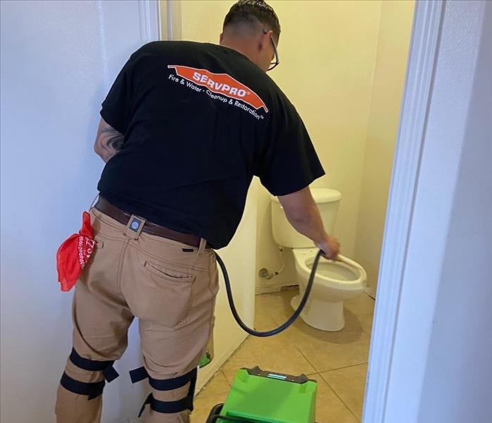SERVPRO technician and equipment at work.
